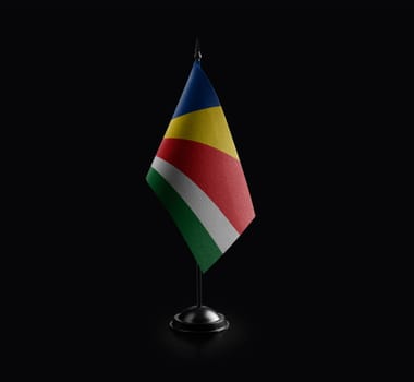 Small national flag of the Seychelles on a black background.