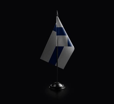 Small national flag of the Finland on a black background.