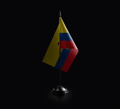 Small national flag of the Ecuador on a black background.