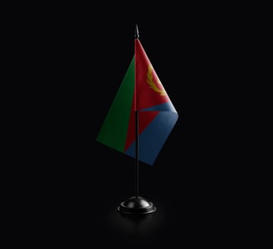 Small national flag of the Eritrea on a black background.