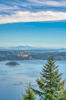 Gorgeous view of Mountain Baker over the ocean bay on blue sky background.