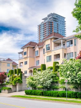 A Perfect Neighbourhood. Italian style low-rise residential building with decorative trees on land terraces