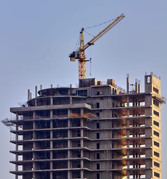 Panoramic view of construction sites and many cranes working in a new construction business.