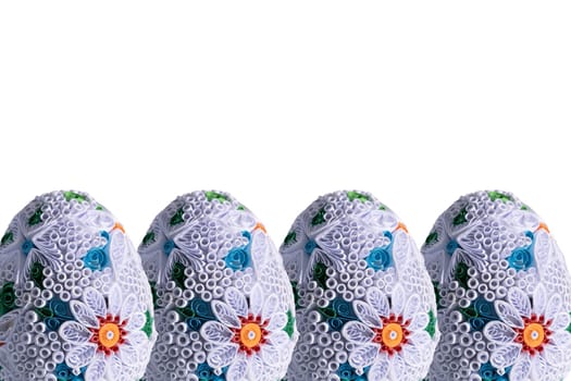 Close-up view of large decorative eggs for Easter. The whole Christmas composition is on a solid white background.