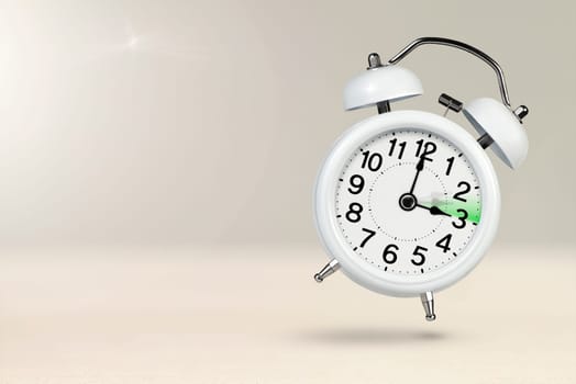 Change time. Summer time concept, on a wooden background. A white alarm clock with a minute hand indicates that the time has been moved forward an hour with copy space