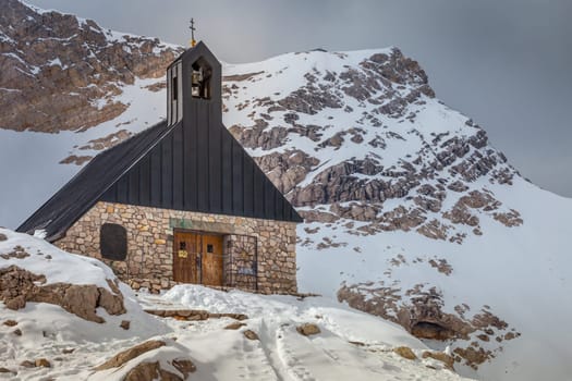 Church chapel and snowcapped Zugspitze, Garmisch Partenkirchen, Bavarian alps in Germany