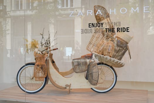ANTWERP , BELGIUM - APRIL 20, 2019: Bike behind glass in a showcase with a logo of the brand Zara Home