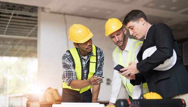 Diverse Team of Specialists Use Laptop on Construction Site. Real Estate Building Project with Engineer Investor and Businessman Checking Area, working on Civil Engineering, Discussing Strategy Plan..