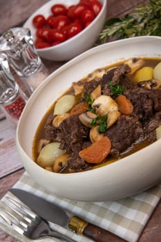 Beef bourguignon recipe, beef stew with wine sauce and vegetables. High quality photo