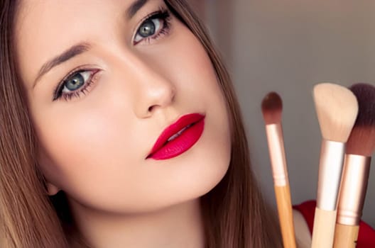 Beauty, makeup and cosmetics, face portrait of beautiful woman with make-up brushes, luxury cosmetic product, makeup artist or beauty blogger concept.