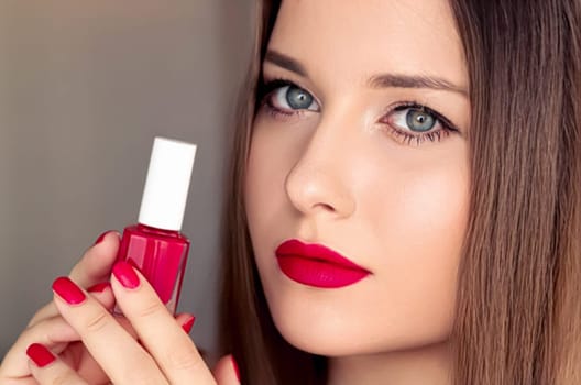 Beauty product, makeup and cosmetics, face portrait of beautiful woman with nail polish, manicure and matching red lipstick make-up for luxury cosmetic, style and fashion.