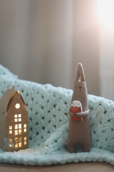 cute soft toy rabbit at home. The hare is a symbol of the new year.