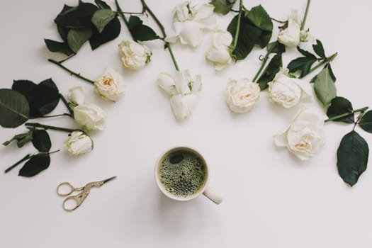 floral composition with white roses on a white background, top view, flatlay