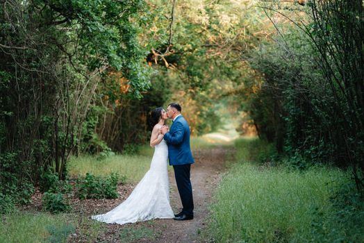 A couple in love a guy and a girl on a walk in the forest belt