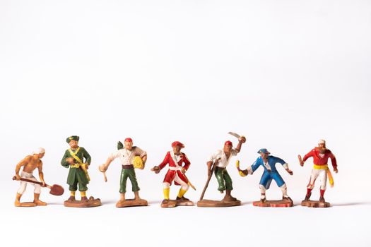 Vintage pirate toys isolated on white background.