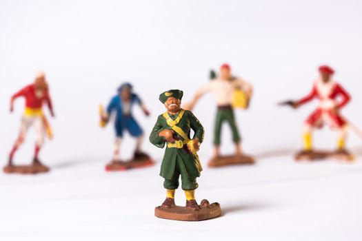 Vintage pirate toys isolated on white background.