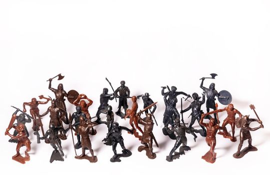 A set of different toy figures of soldiers on a white background.