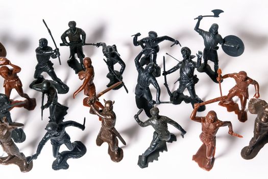 A set of different toy figures of soldiers on a white background.