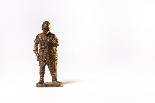 Vintage toy brown soldier knight isolated on white background.