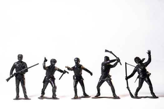 Vintage toy black soldiers isolated on white background.