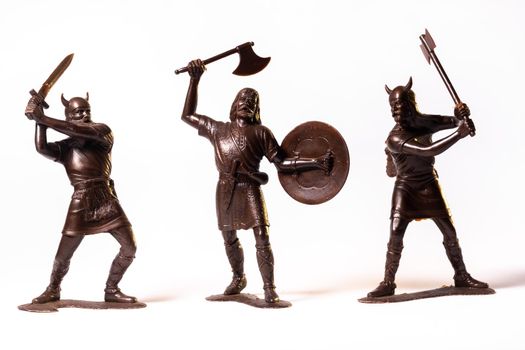 Vintage toy Brown Viking soldiers isolated on white background.