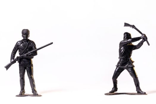 Vintage toy black soldiers isolated on white background.