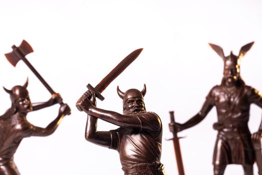 Vintage toy Brown Viking soldiers isolated on white background.