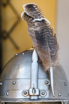 An ancient knight's helmet with a feather .Medieval concept.