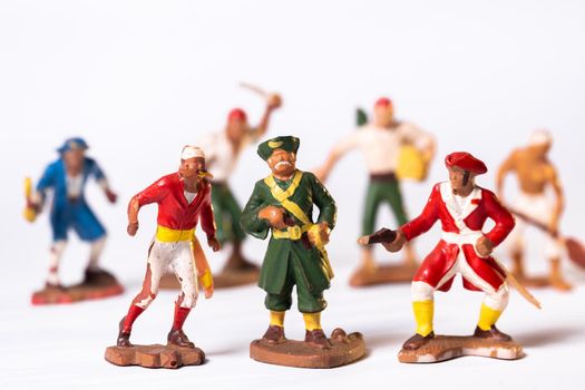 Vintage pirate toys isolated on white background.