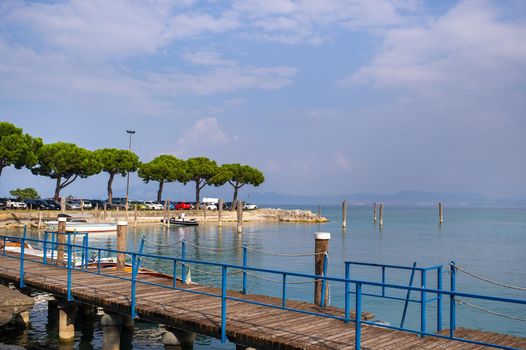 The promenade and pier in Sirmione on Lake Garda.Italy.Tuscany.