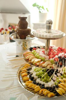 Fondue with a chocolate fountain and sweets for it.Sweet theme.