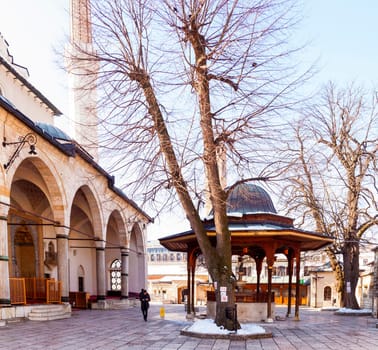 SARAJEVO, BOSNIA-ERZEGOVINA - FEBRUARY, 16: View of the Shadirvan Fountain on courtyard of Gazi Husrev-bey Mosque in Sarajevo on February 16, 2018