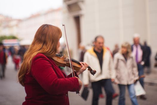 TRIESTE, ITALY - MAY, 14: Female violinist playing in the street on May 14, 2016