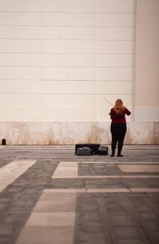 TRIESTE, ITALY - MAY, 14: Female violinist playing in the street on May 14, 2016