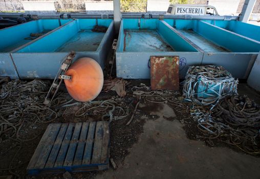 Old tanks for the fish processing, Villaggio del Pescatore. Italy