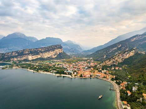 Top view of Lake Lago di Garda and the village of Torbole, alpine scenery. Italy.