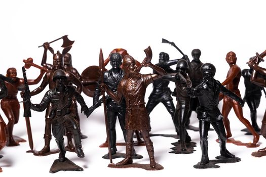 A set of different toy figures of soldiers on a white background.