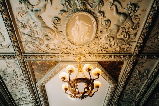 Antique crystal chandelier chandelier in the palace. Large chandelier in the castle.
