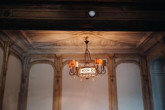 Antique crystal chandelier chandelier in the palace. Large chandelier in the castle.