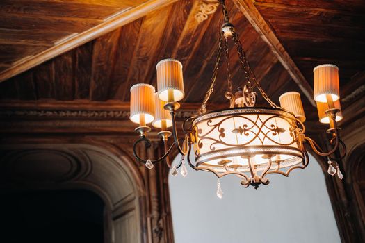 Antique crystal chandelier chandelier in the palace. Large chandelier in the castle.
