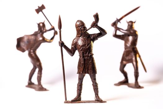 Vintage toy Brown Viking soldiers isolated on white background.