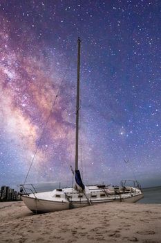 Milky way in the night sky over a shipwreck off the coast of Clam Pass in Naples, Florida