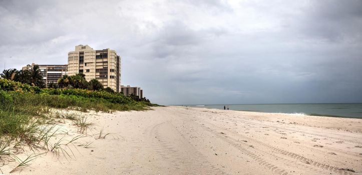 Dreary Grey sky over the beach of Park Shore Beach in Naples, Florida