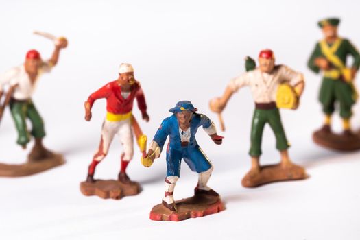 Vintage pirate toys isolated on white background.