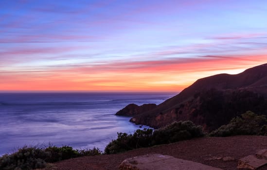 Beautiful sunset on Pacific ocean and cliffs of Northern California coast. High quality photo