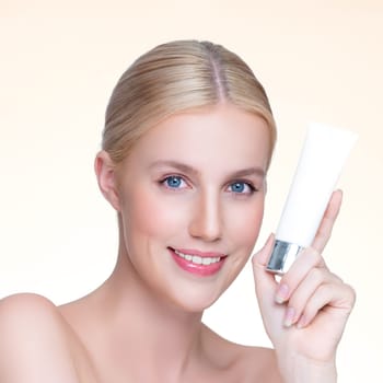 Closeup personable beautiful perfect natural skin woman hold mockup tube moisturizer cream for skincare treatment product advertising expressive facial and gesture expression in isolated background.