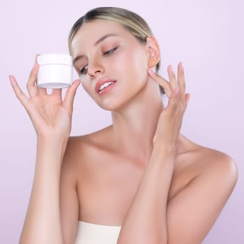 Alluring beautiful perfect cosmetic skin woman portrait hold mockup jar cream or moisturizer for skincare treatment, anti-aging product in isolated background. Natural healthy skin model concept.