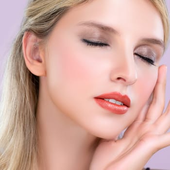 Closeup pretty beautiful woman with alluring perfect smooth and clean skin portrait in pink isolated background. Hand gesture with expressive facial expression for beauty model concept.