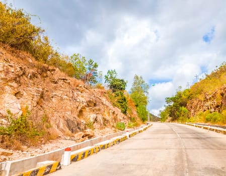 Bright sunshine day time Highway curve road overpass nature landscape background street tall lanterns trees bushes sideway.