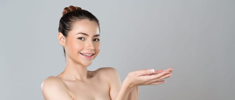 Glamorous beautiful woman with perfect smooth pure clean skincare with soft makeup in isolated background. Beauty hand gesture with expressive facial expression for advertising and indicate promotion.